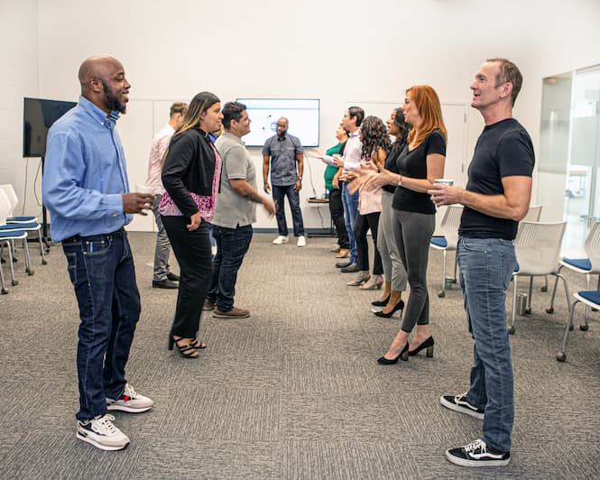 participants conversing in classroom